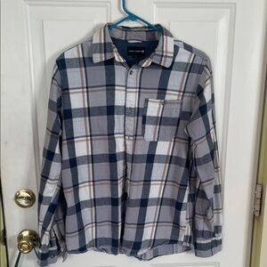 Navy and tan button down shirt.